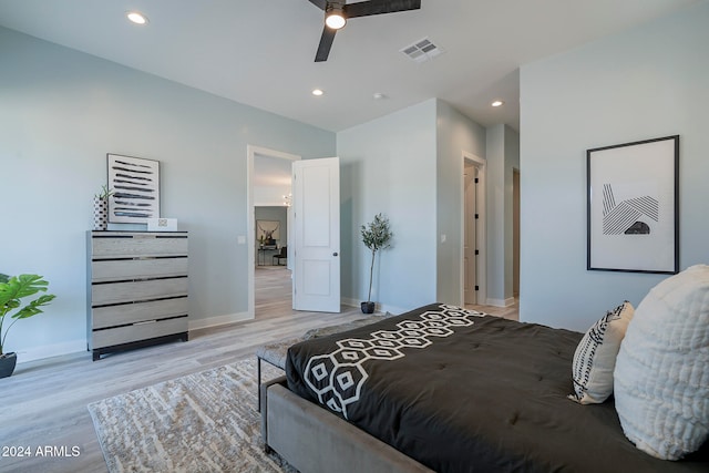 bedroom featuring light hardwood / wood-style floors and ceiling fan