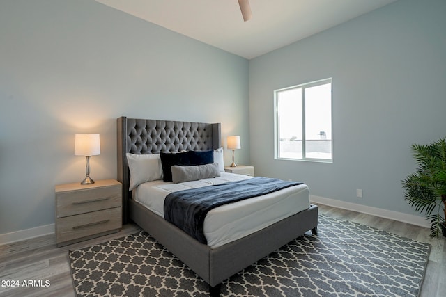 bedroom featuring ceiling fan and hardwood / wood-style flooring