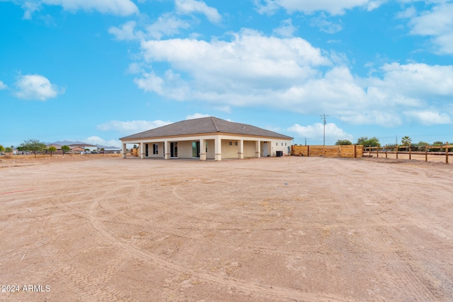 rear view of property featuring a rural view