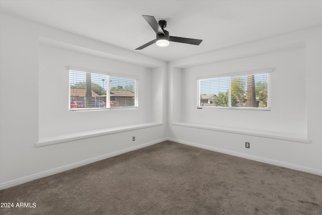 spare room with carpet and ceiling fan