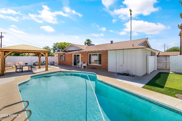 view of swimming pool featuring a gazebo and a patio area