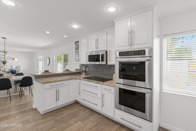 full bathroom with vanity, toilet, hardwood / wood-style floors, and tiled shower / bath