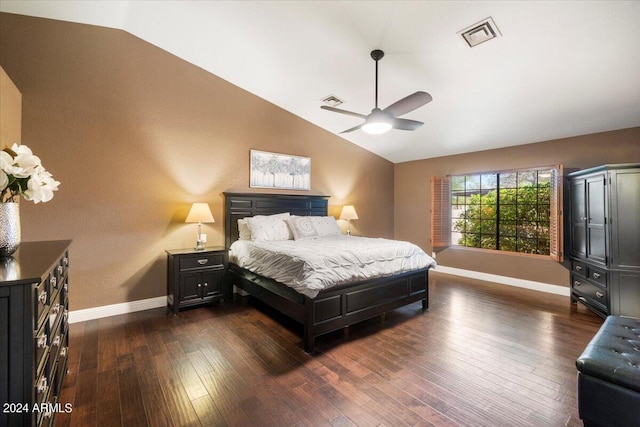 bedroom with vaulted ceiling, ceiling fan, and dark hardwood / wood-style flooring