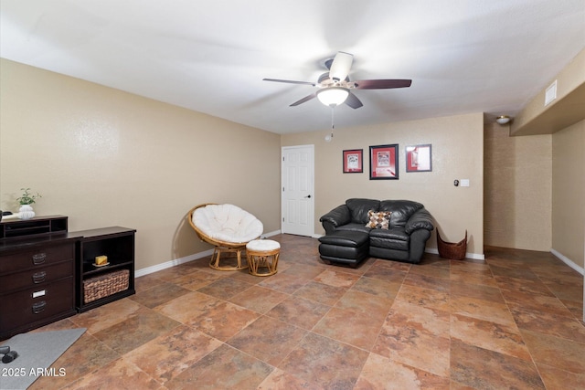 living area with ceiling fan