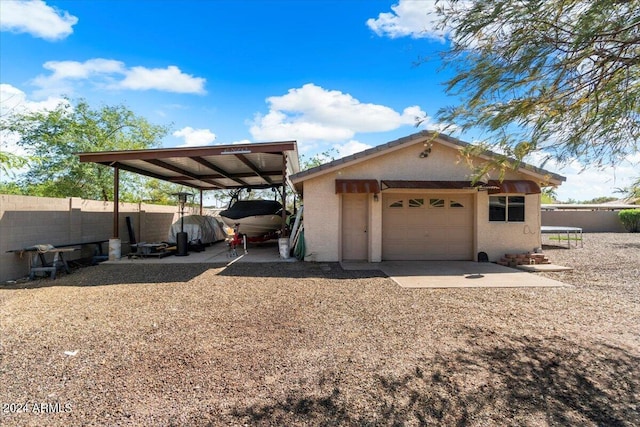 exterior space featuring a garage and a carport