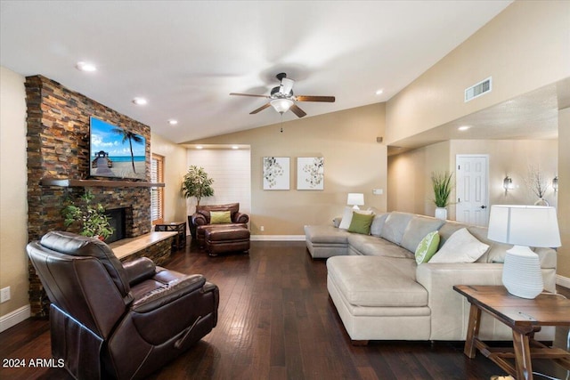 living room with a stone fireplace, vaulted ceiling, dark hardwood / wood-style floors, and ceiling fan