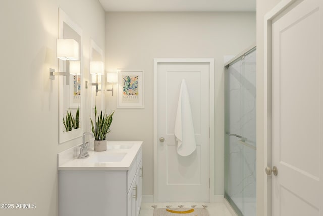 bathroom with walk in shower and vanity