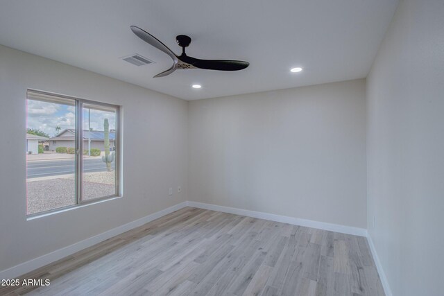 empty room with visible vents, recessed lighting, light wood-style floors, baseboards, and ceiling fan