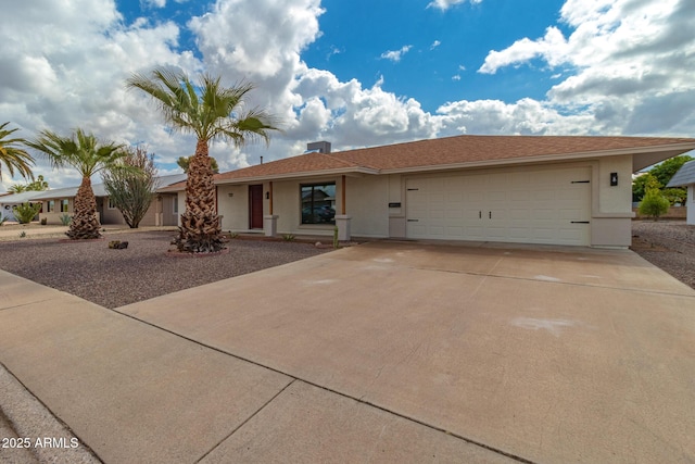 ranch-style house with stucco siding, driveway, and an attached garage