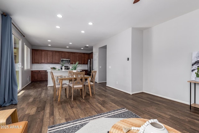 dining room with dark hardwood / wood-style floors