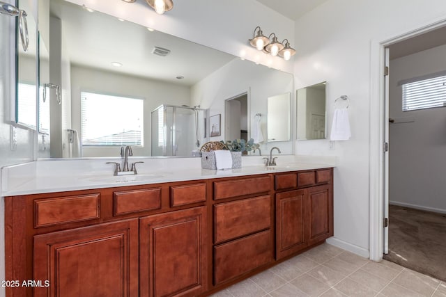 bathroom featuring vanity, an enclosed shower, and tile patterned floors