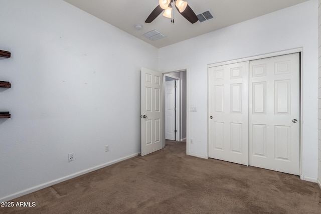 unfurnished bedroom featuring carpet floors, a closet, and ceiling fan