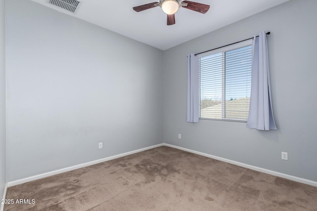 empty room with light colored carpet and ceiling fan