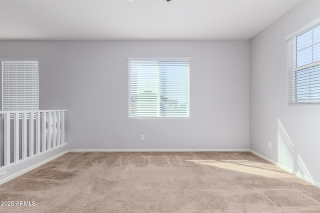 spare room with light colored carpet