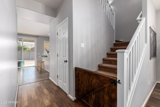 stairway featuring hardwood / wood-style floors