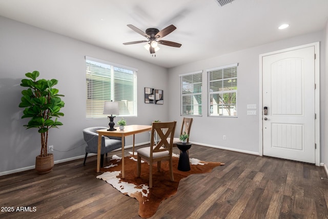 dining room featuring dark hardwood / wood-style floors and ceiling fan