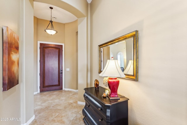 foyer entrance with light tile patterned flooring