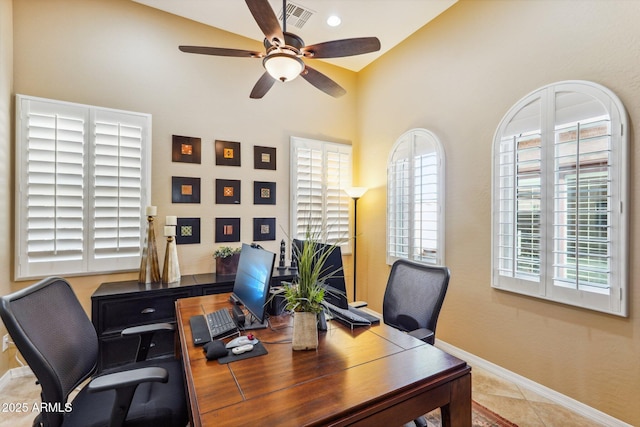 home office featuring light tile patterned floors and ceiling fan