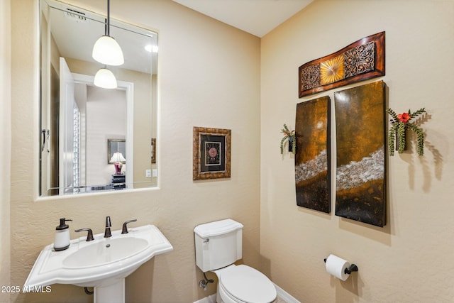 bathroom featuring sink and toilet