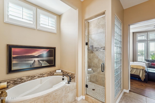 bathroom featuring independent shower and bath and tile patterned flooring