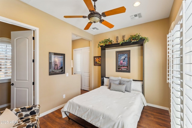 bedroom featuring dark hardwood / wood-style floors and ceiling fan