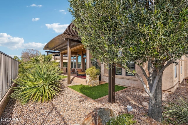 rear view of property with a patio area