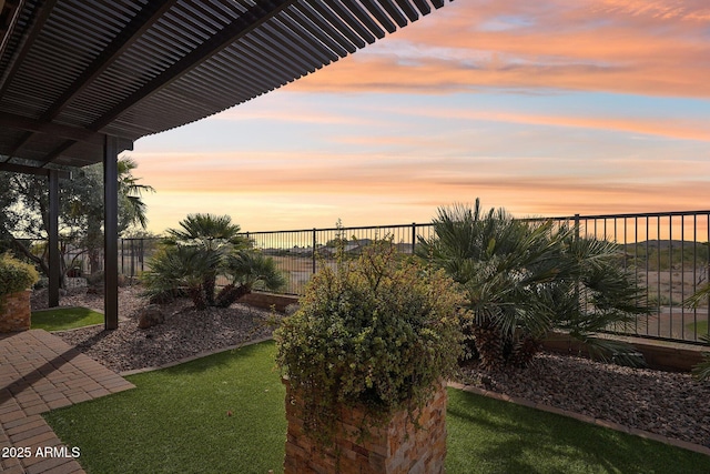 view of yard at dusk