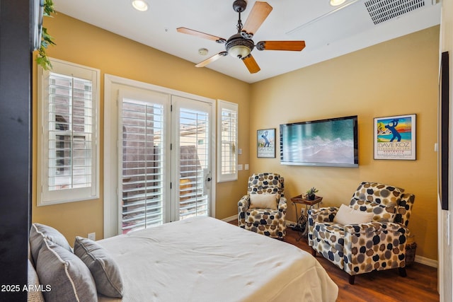 bedroom with ceiling fan, dark hardwood / wood-style floors, and access to outside