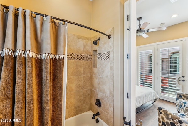 bathroom featuring shower / bath combination with curtain and ceiling fan