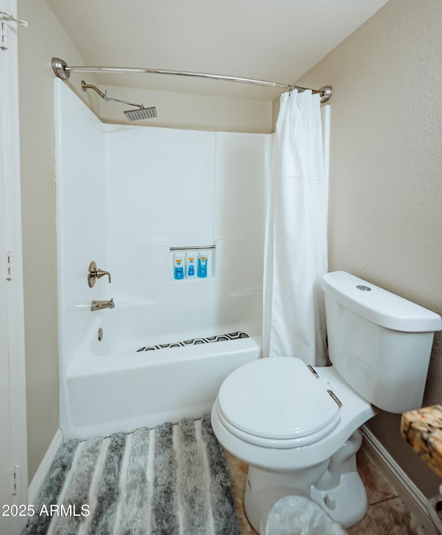 full bathroom with tile patterned flooring, toilet, shower / bath combo, and baseboards