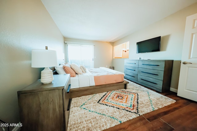 bedroom featuring dark wood-type flooring