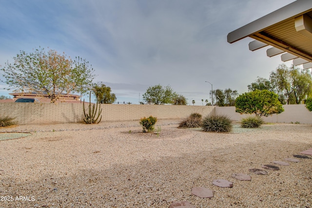 view of yard featuring a fenced backyard