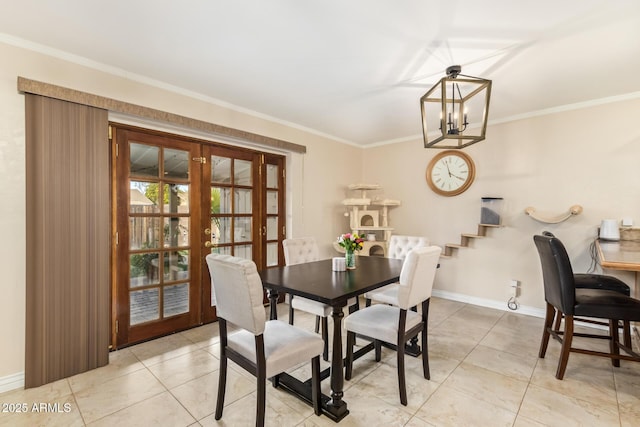 dining space featuring ornamental molding, light tile patterned floors, a chandelier, and french doors