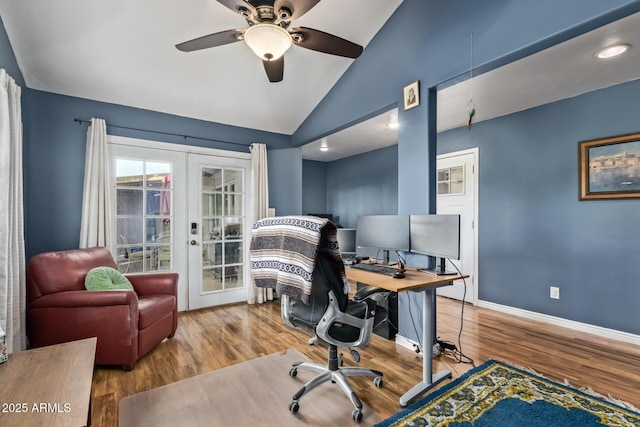 office space featuring lofted ceiling, hardwood / wood-style flooring, french doors, and ceiling fan