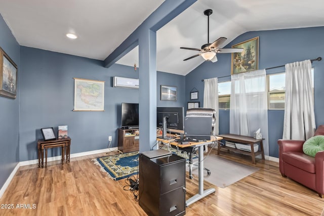 home office featuring ceiling fan, lofted ceiling, a wall unit AC, and light hardwood / wood-style flooring