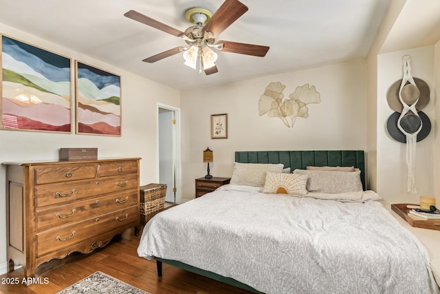 bedroom featuring hardwood / wood-style floors and ceiling fan