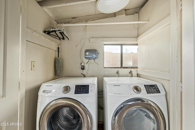 washroom with washing machine and clothes dryer