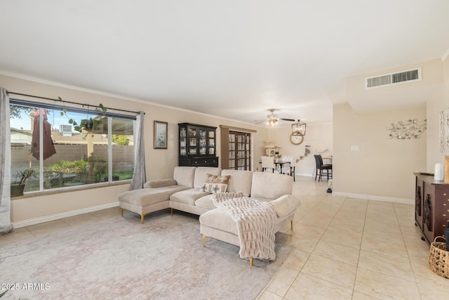 tiled living room featuring crown molding and ceiling fan