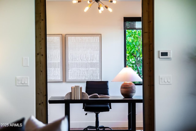 office space with a notable chandelier