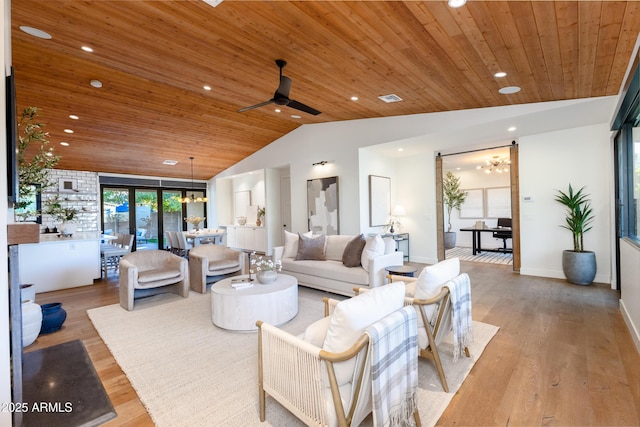 living room featuring lofted ceiling, ceiling fan with notable chandelier, light hardwood / wood-style floors, and wooden ceiling