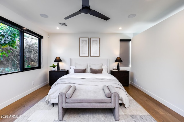 bedroom featuring hardwood / wood-style flooring and ceiling fan