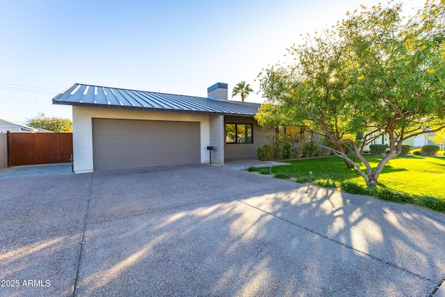 view of front facade with a garage and a front yard