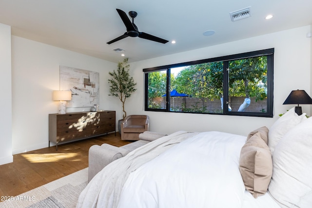 bedroom featuring ceiling fan and wood-type flooring