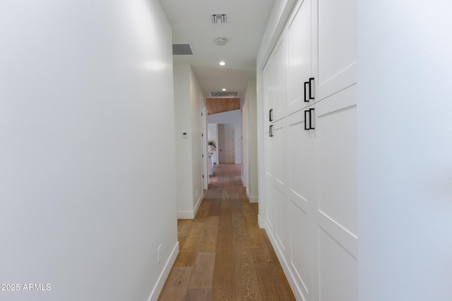 hallway featuring hardwood / wood-style flooring