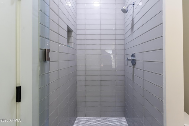 bathroom with tiled shower