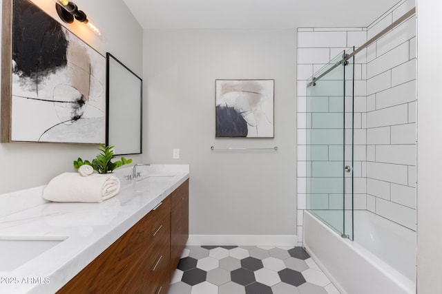 bathroom with vanity and tiled shower / bath combo