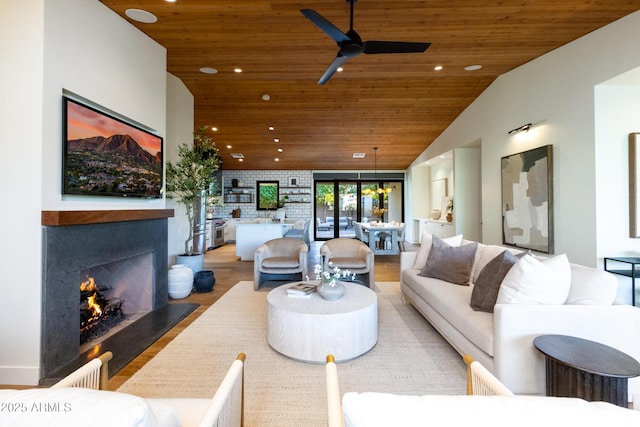 living room with high vaulted ceiling, hardwood / wood-style floors, and wood ceiling