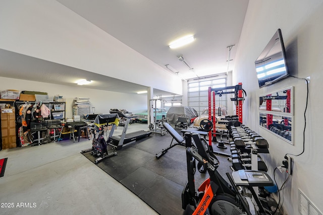 3907 S 75th Dr, Phoenix, AZ 85043 - gym featuring visible vents and a garage