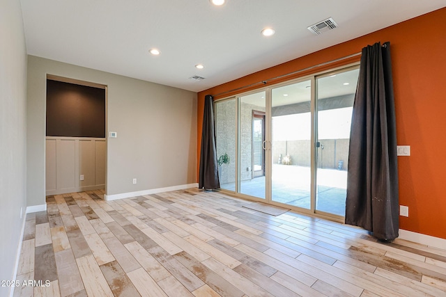 3907 S 75th Dr, Phoenix, AZ 85043 - empty room with baseboards, visible vents, recessed lighting, and light wood-style floors