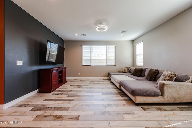 3907 S 75th Dr, Phoenix, AZ 85043 - living area with baseboards, light wood-style flooring, and visible vents
